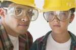 father & son with hard hats